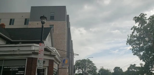 Modern building with brick and metal siding exterior at Lofts at Gold Street in Rochester Student Accommodation