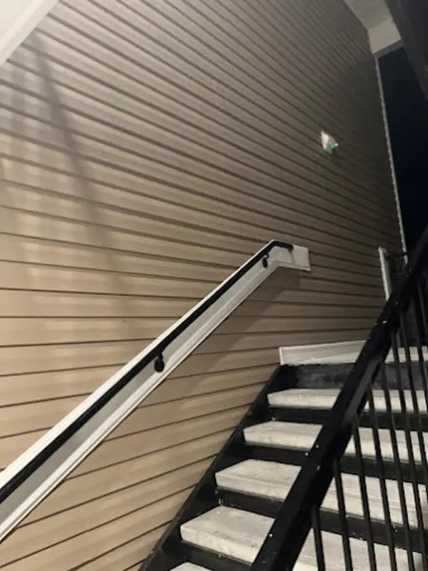 Stairs with handrails and siding exterior at Seahawk Cove in Wilmington Student Accommodation