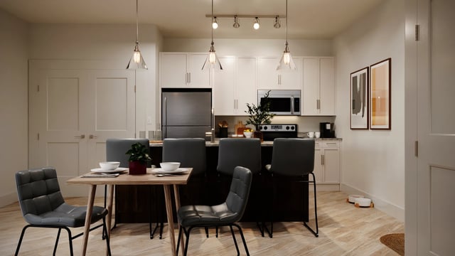 Dining table chairs and kitchen island kitchen at Derby Row in Louisville Student Accommodation