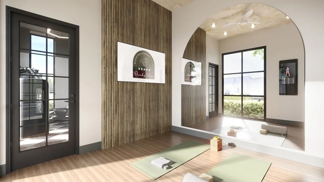 Yoga mats with blocks and mirrors exercise area at Derby Row in Louisville Student Accommodation