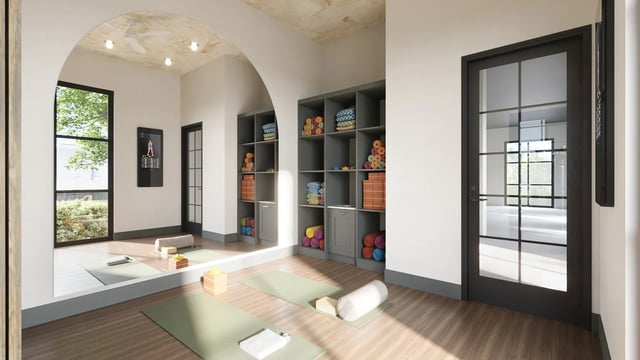 Yoga mats storage shelves digital fitness mirror fitness room at Derby Row in Louisville Student Accommodation