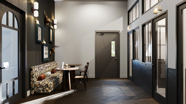 Seating area with tables and chairs communal space at Derby Row in Louisville Student Accommodation