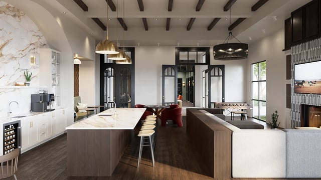 Kitchen island with stools foosball table sofas fireplace living area at Derby Row in Louisville Student Accommodation