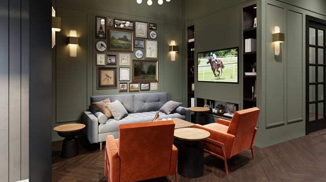 Sofa artwork TV orange chairs living room at Derby Row in Louisville Student Accommodation