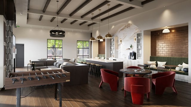 Foosball table sofas kitchen island lounge seating living area at Derby Row in Louisville Student Accommodation