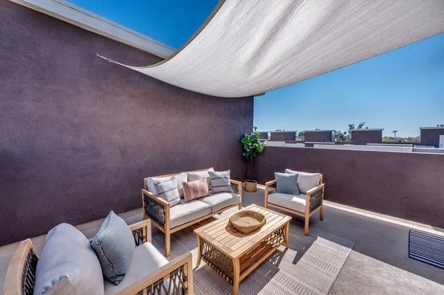Outdoor seating with coffee table on patio living room at Lofts on 8th in Tempe Student Accommodation