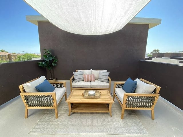 Outdoor living area with seating and table balcony at Lofts on 8th in Tempe Student Accommodation