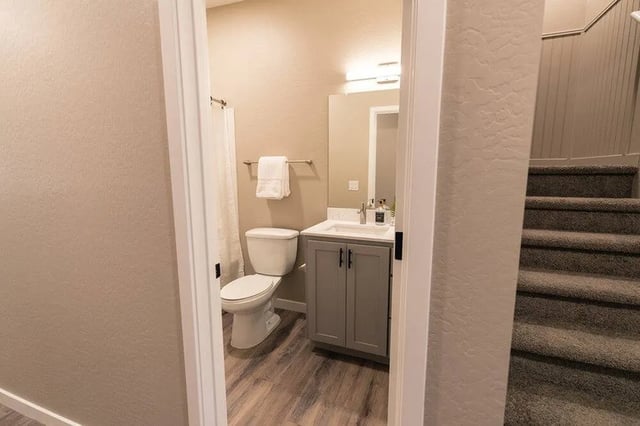 Toilet sink vanity and stairs image at Lofts on 8th in Tempe Student Accommodation