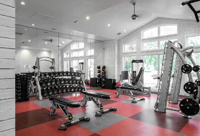Dumbbells weight benches and machines gym equipment at The Madison in Ames Student Accommodation