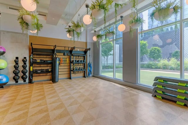 Gym equipment with weights and punch bag fitness area at The Connector in Atlanta Student Accommodation