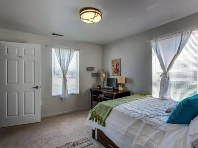 Bed desk computer and window bedroom at The Landings at Chandler Crossings in East Lansing Student Accommodation