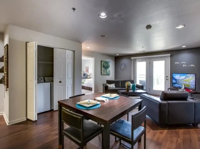Dining table washer dryer living room living area at The Landings at Chandler Crossings in East Lansing Student Accommodation