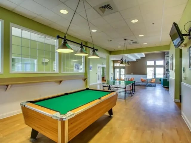 Pool table ping pong table lounge area playing area at The Landings at Chandler Crossings in East Lansing Student Accommodation