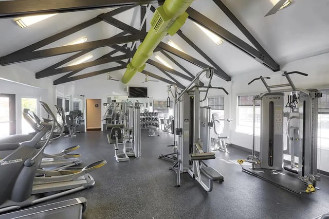 Gym equipment elliptical machines and weights gym at Tremont Student Living in State College Student Accommodation