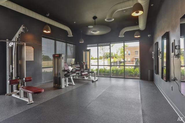 Gym equipment exercise machines and mirrored walls gym at The Nine at Columbia in Columbia Student Accommodation