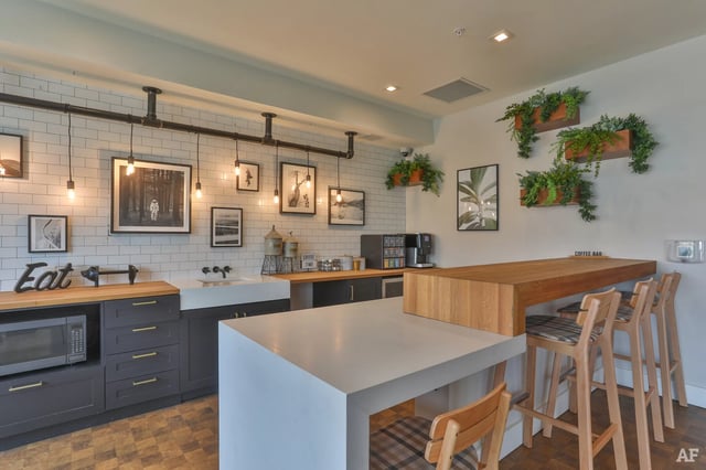 Modern kitchen with subway tiles and bar seating Kitchen at The Nine at Columbia in Columbia Student Accommodation