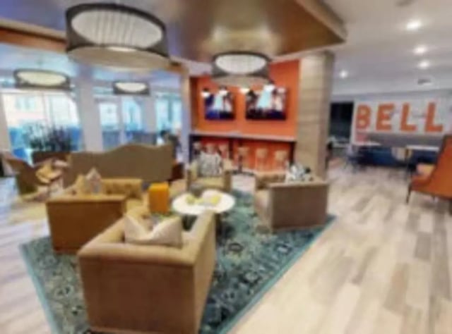 Lounge area with sofas chairs and tables living room at Luxe Belle in Columbus Student Accommodation