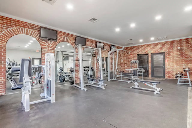 Weight machines and benches gym area. at 2909 Oliver in Wichita Student Accommodation