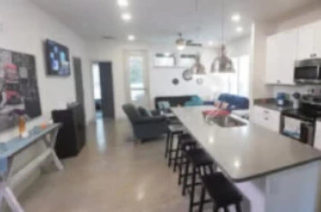Modern open-plan living area and kitchen living room at The District at Clemson in Clemson Student Accommodation