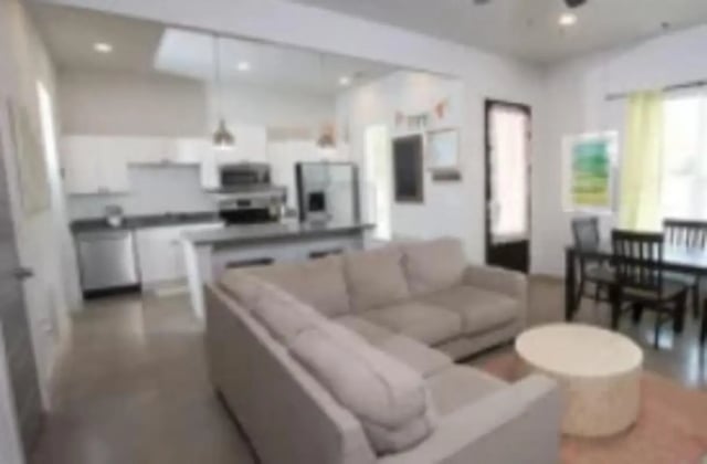 Living room with kitchen and dining area living room at The District at Clemson in Clemson Student Accommodation