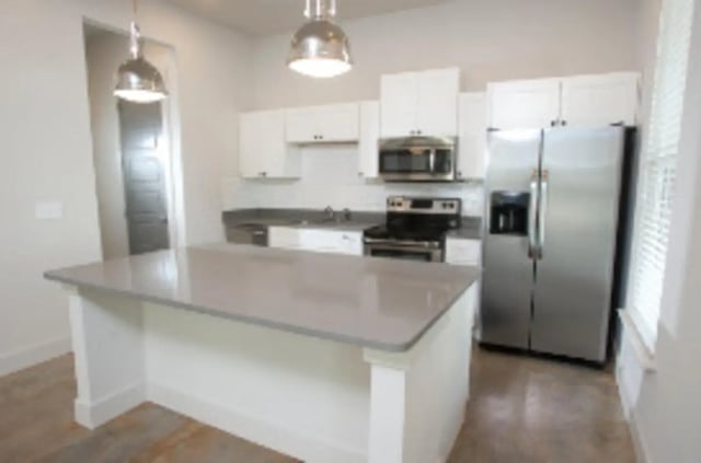 Kitchen island stainless steel appliances cabinets kitchen at The District at Clemson in Clemson Student Accommodation