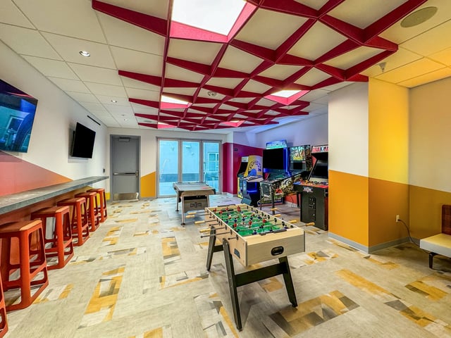 Foosball table arcade games and pool table playing area at Topaz in San Diego Student Accommodation