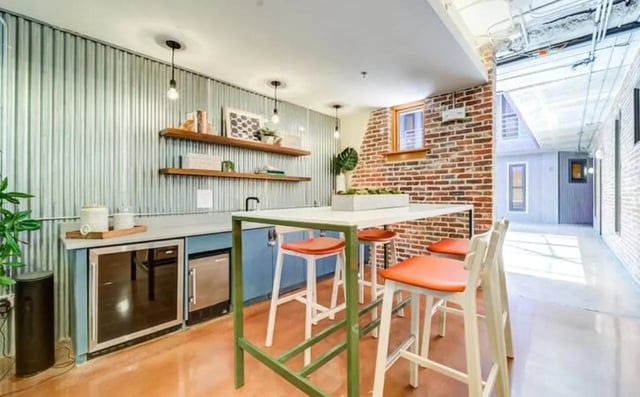 Bar area with mini fridges and high chairs common area at The Warehouse Apartments Chapel Hill in Chapel Hill Student Accommodation