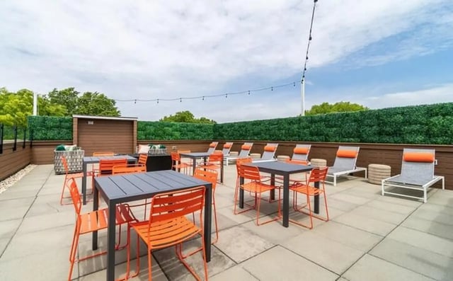 Outdoor seating lounge chairs and tables patio area at The Warehouse Apartments Chapel Hill in Chapel Hill Student Accommodation