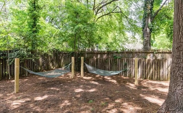 Two hammocks strung between wooden posts exterior at The Warehouse Apartments Chapel Hill in Chapel Hill Student Accommodation