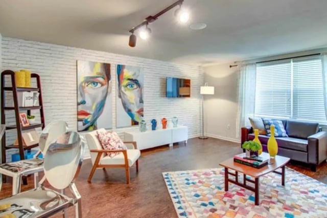 Two paintings modern couch coffee table living room at Gateway at Huntsville in Huntsville Student Accommodation
