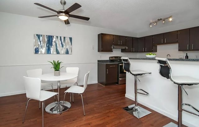 Dining set kitchen island bar stools kitchen living area at The Den at Clemson in Clemson Student Accommodation