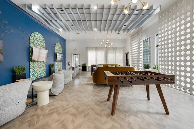 Foosball table couch bean bags living room at On20 Apartments in Gainesville Student Accommodation