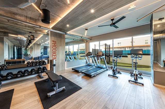 Treadmills exercise bikes weights bench gym at 21 Rio in Austin Student Accommodation