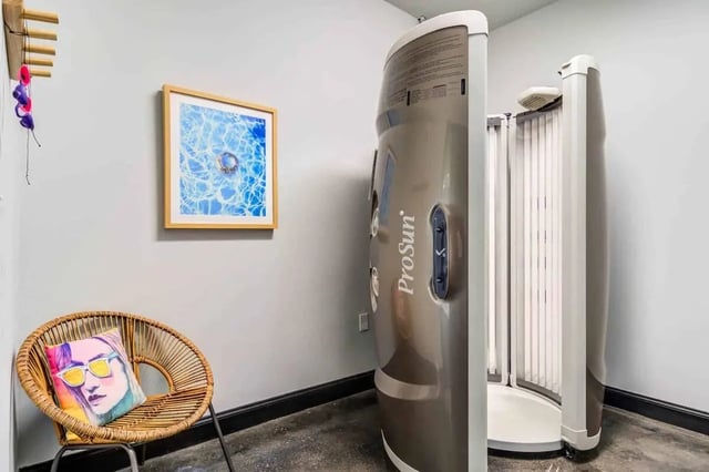 Tanning booth and chair with pillow Tanning booth at Gamecock Village in Jacksonville Student Accommodation