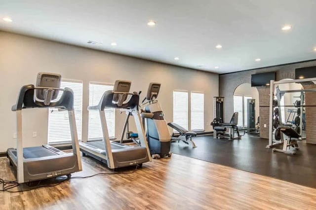 Treadmills weight machines gym bench exercise room at Gamecock Village in Jacksonville Student Accommodation