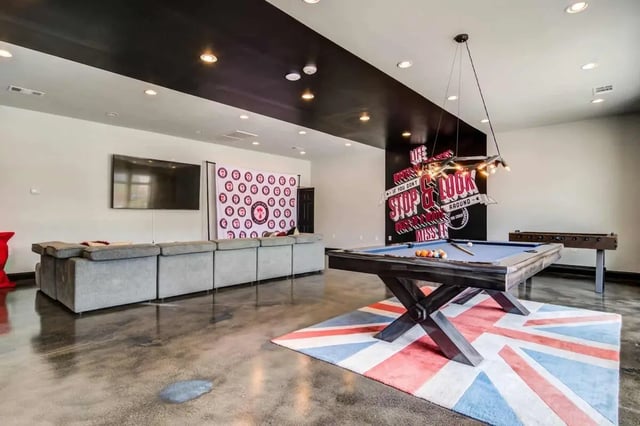 Pool table foosball table sofa living room at Gamecock Village in Jacksonville Student Accommodation