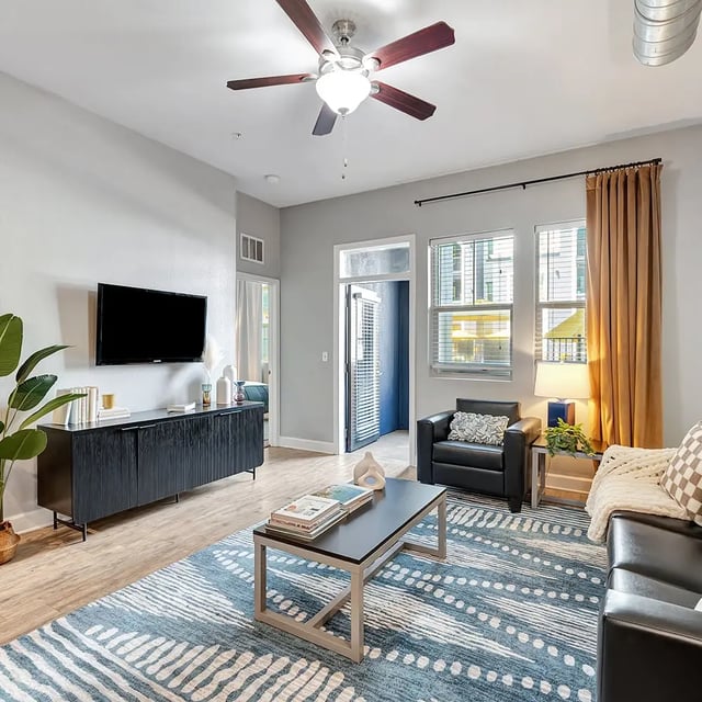 Modern living room with TV couch and coffee table living room at Iconic on Alvarado in San Diego Student Accommodation