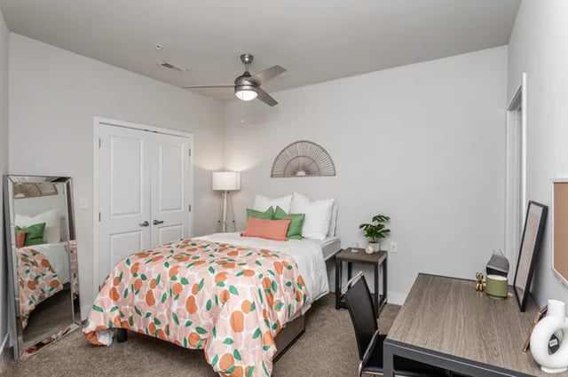 Bed desk mirror and fan bedroom at Vue on Walnut in Springfield Student Accommodation