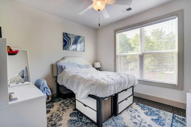 Bed with storage drawers artwork window bedroom at 1820 at Centennial in Raleigh Student Accommodation