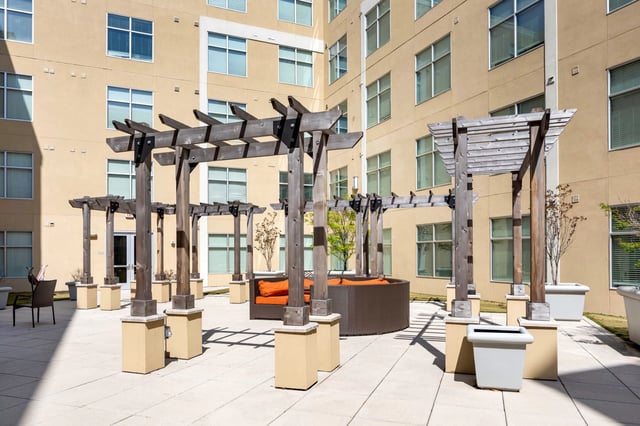 Outdoor lounge area with seating and pergolas Exterior at 200 Edgewood in Atlanta Student Accommodation