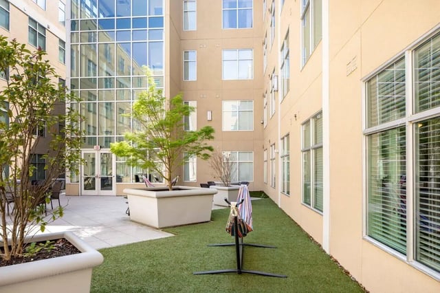 Courtyard with plants chairs and hammock exterior at 200 Edgewood in Atlanta Student Accommodation