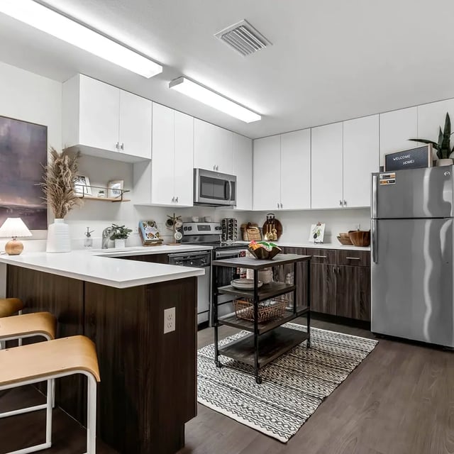 Modern kitchen with island and refrigerator kitchen at Social28 in Gainesville Student Accommodation