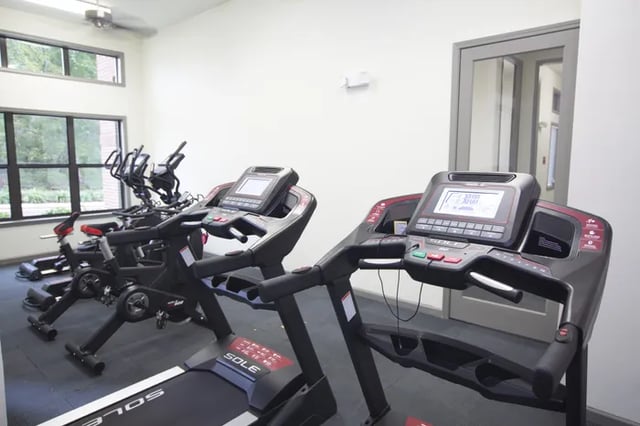 Treadmills and exercise bikes fitness room at Balcony Starkville in Starkville Student Accommodation