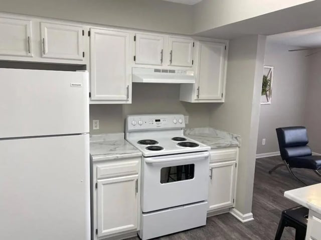 White refrigerator stove cabinets countertops kitchen at 1909 Campus Flats in Bowling Green Student Accommodation