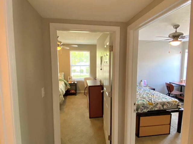 Two bedrooms with beds and desks bedroom at 1909 Campus Flats in Bowling Green Student Accommodation