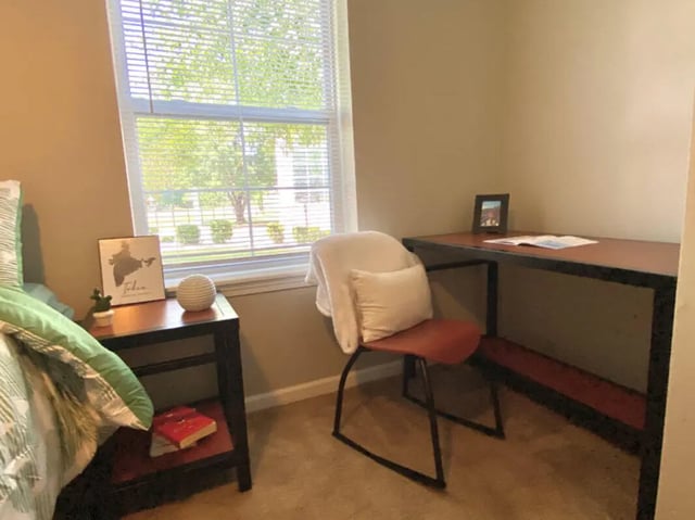 Desk chair bedside table window study area at 1909 Campus Flats in Bowling Green Student Accommodation