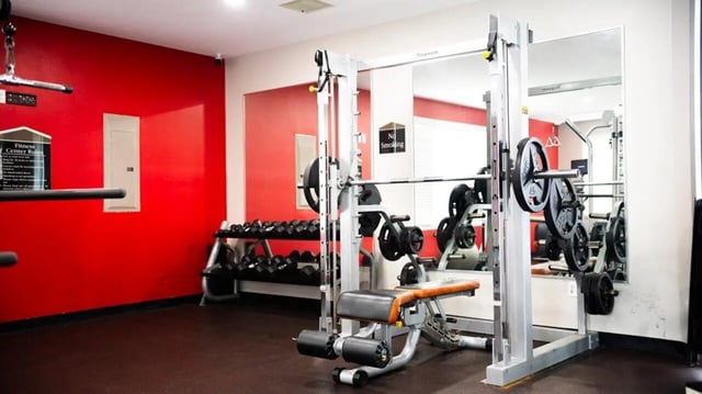 Weight rack bench and smith machine gym at 1909 Campus Flats in Bowling Green Student Accommodation