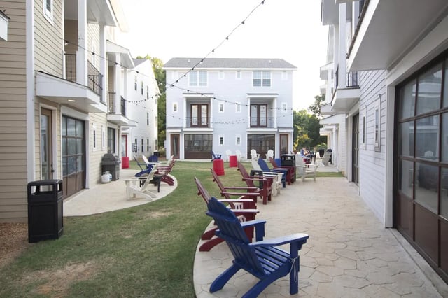 Adirondack chairs on patio outdoor seating area exterior at West 100 Oxford Apartments in Oxford Student Accommodation