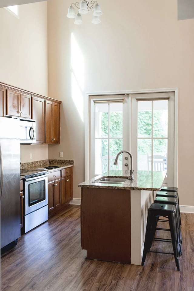 Stainless steel appliances granite counter island kitchen at 607 South Oxford Apartments in Oxford Student Accommodation