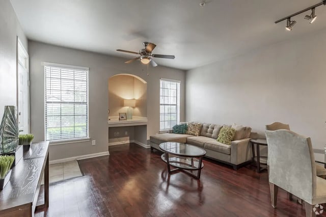 Sofa coffee table desk and lamp living room at Heron on Hausman in San Antonio Student Accommodation